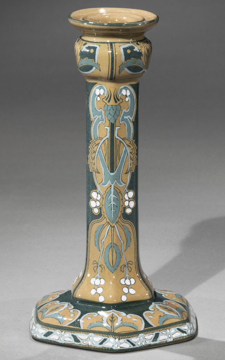 Multicolored pottery candlestick with botanical and other designs