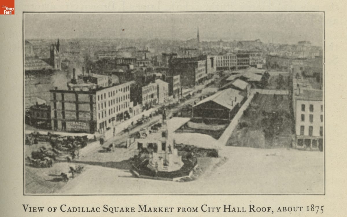 Street scene with buildings, people, and horse carriages