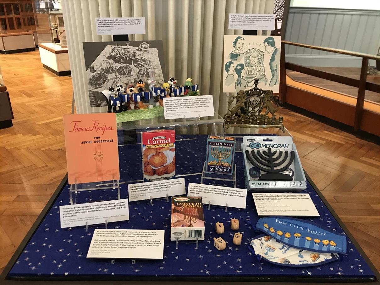Exhibit case holding various items and textual cards