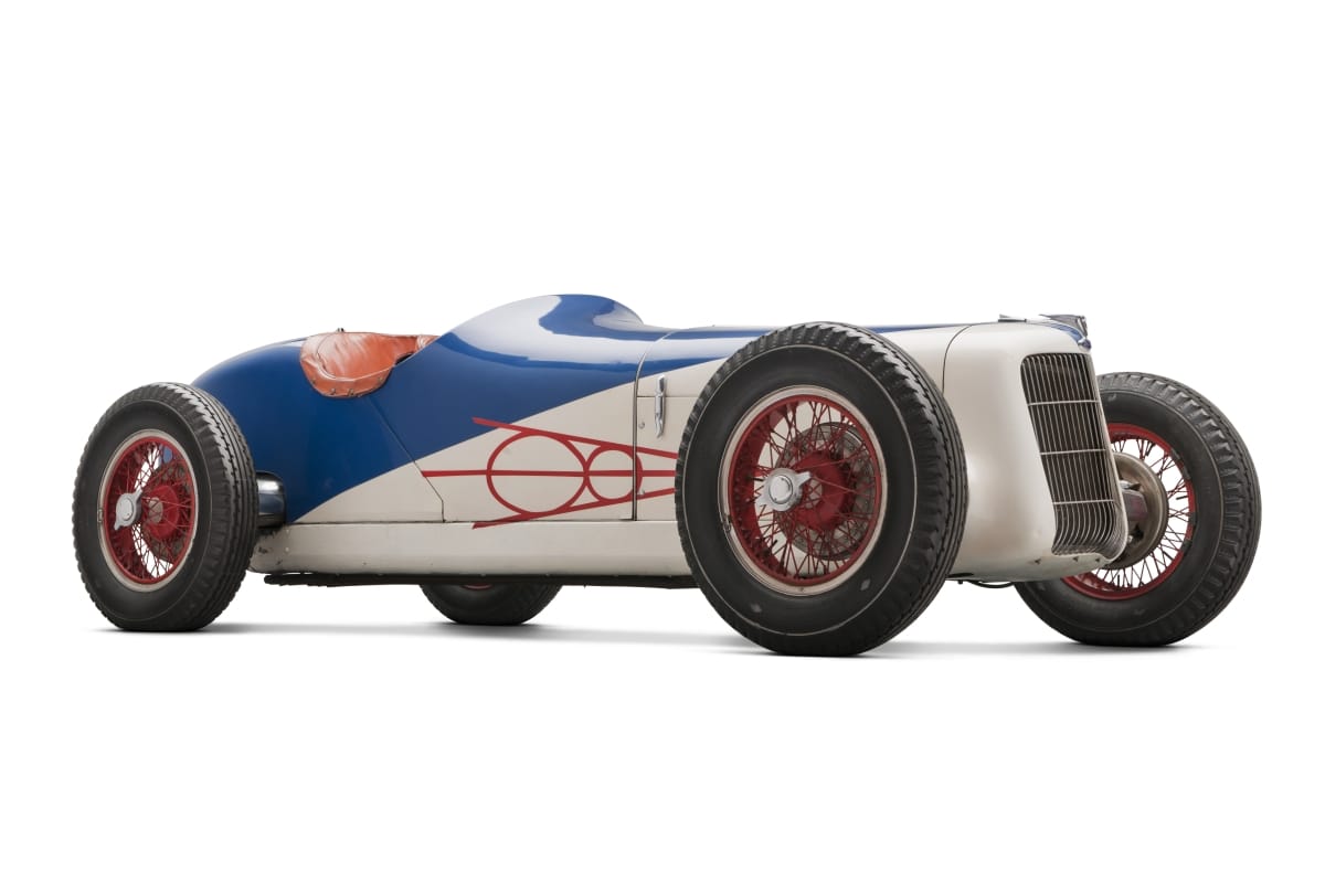 Narrow, blue and white, open cockpit race car
