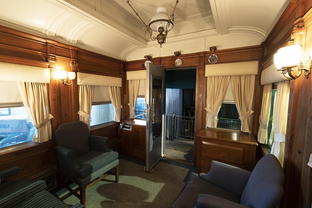 Interior space with blue upholstered furniture and wood paneling