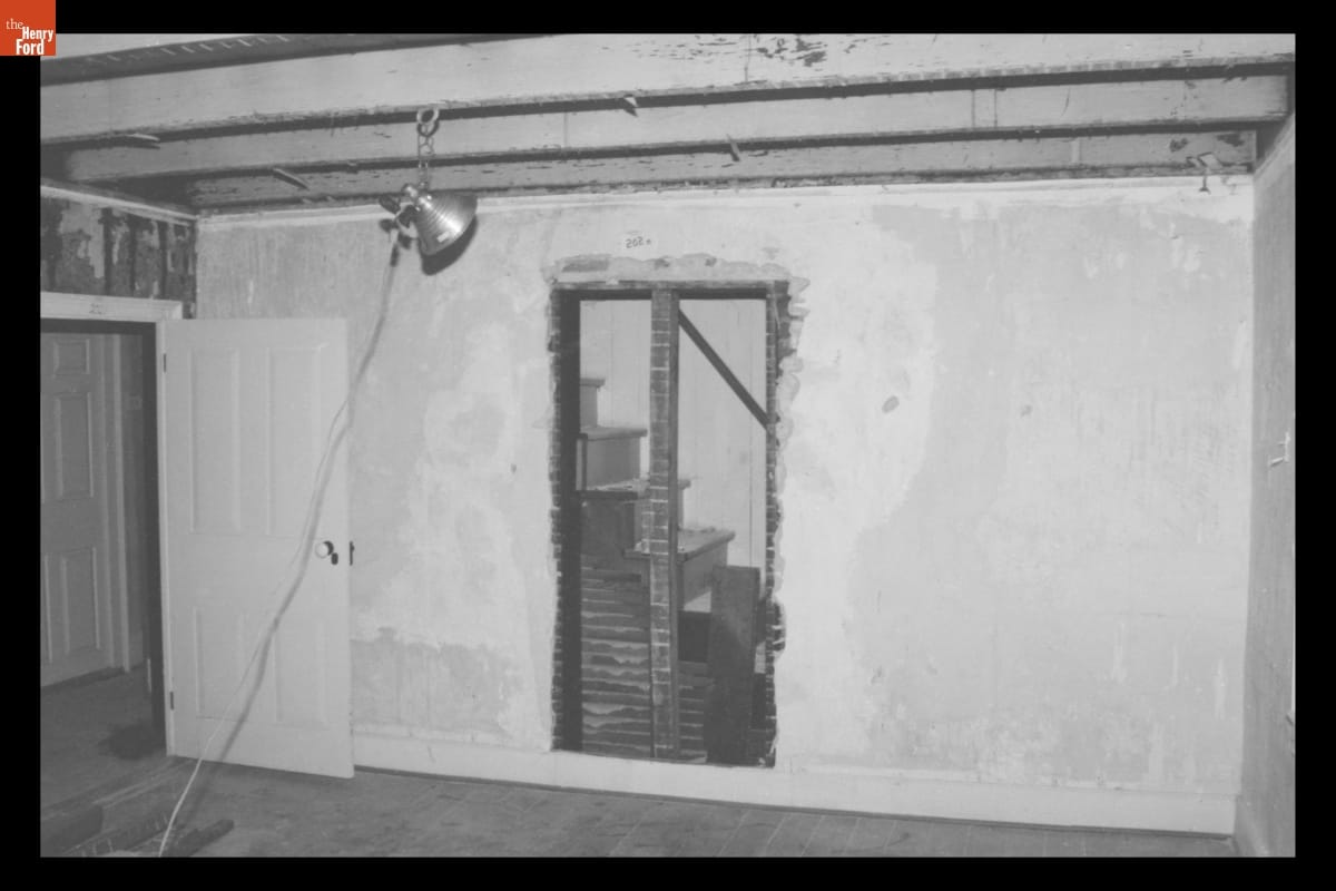 Unfinished wall with open door-shaped hole in it