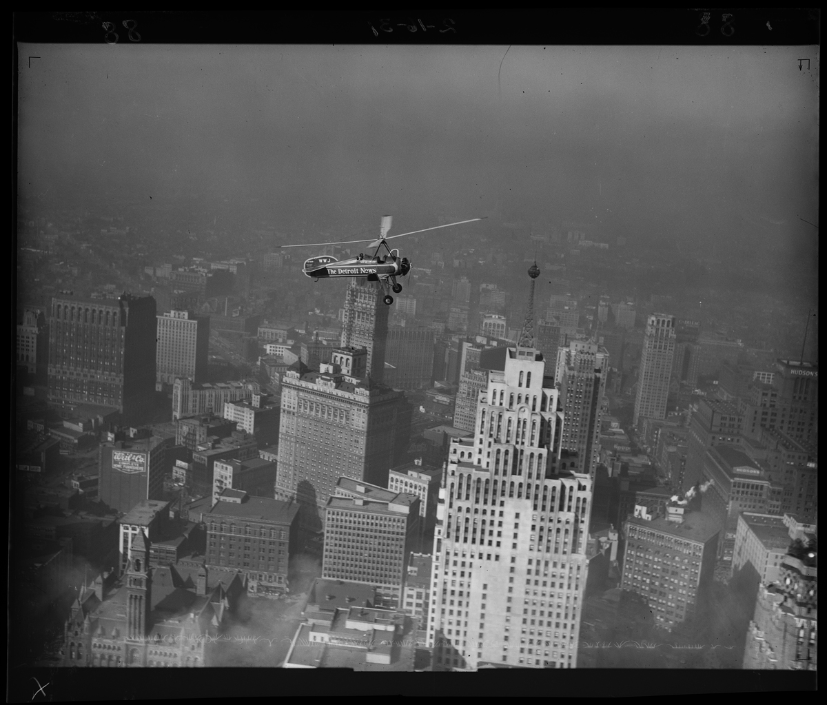 Aircraft flying over tall buildings