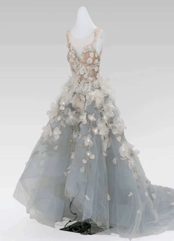 GIF running through various views and details of a dress on a dress form