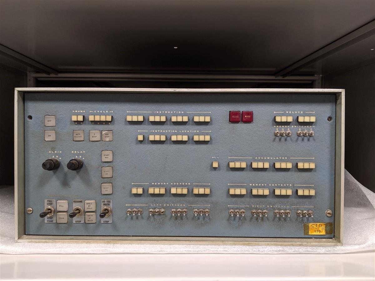 Blue console with many buttons and switches