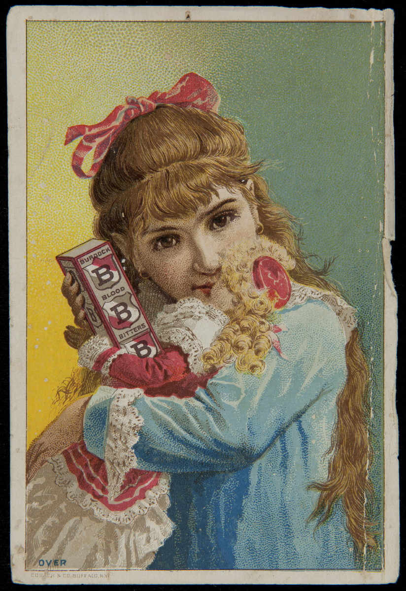 Image of young girl with long blonde hair holding doll and box
