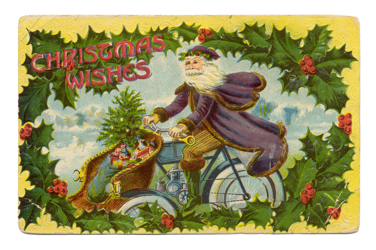 Postcard of St. Nick in purple cape on motorcycle with toys in front basket; contains text and border of holly leaves and berries