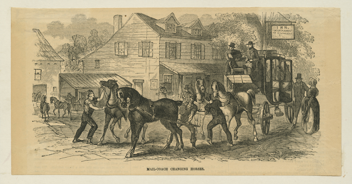 Two-story building with horses, carriages, and people in front of it and other buildings nearby