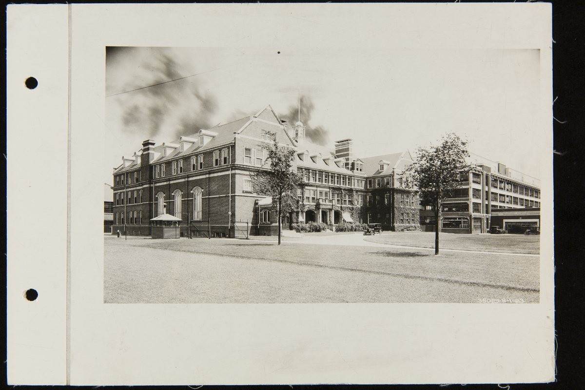 Large, multi-story brick building with many windows