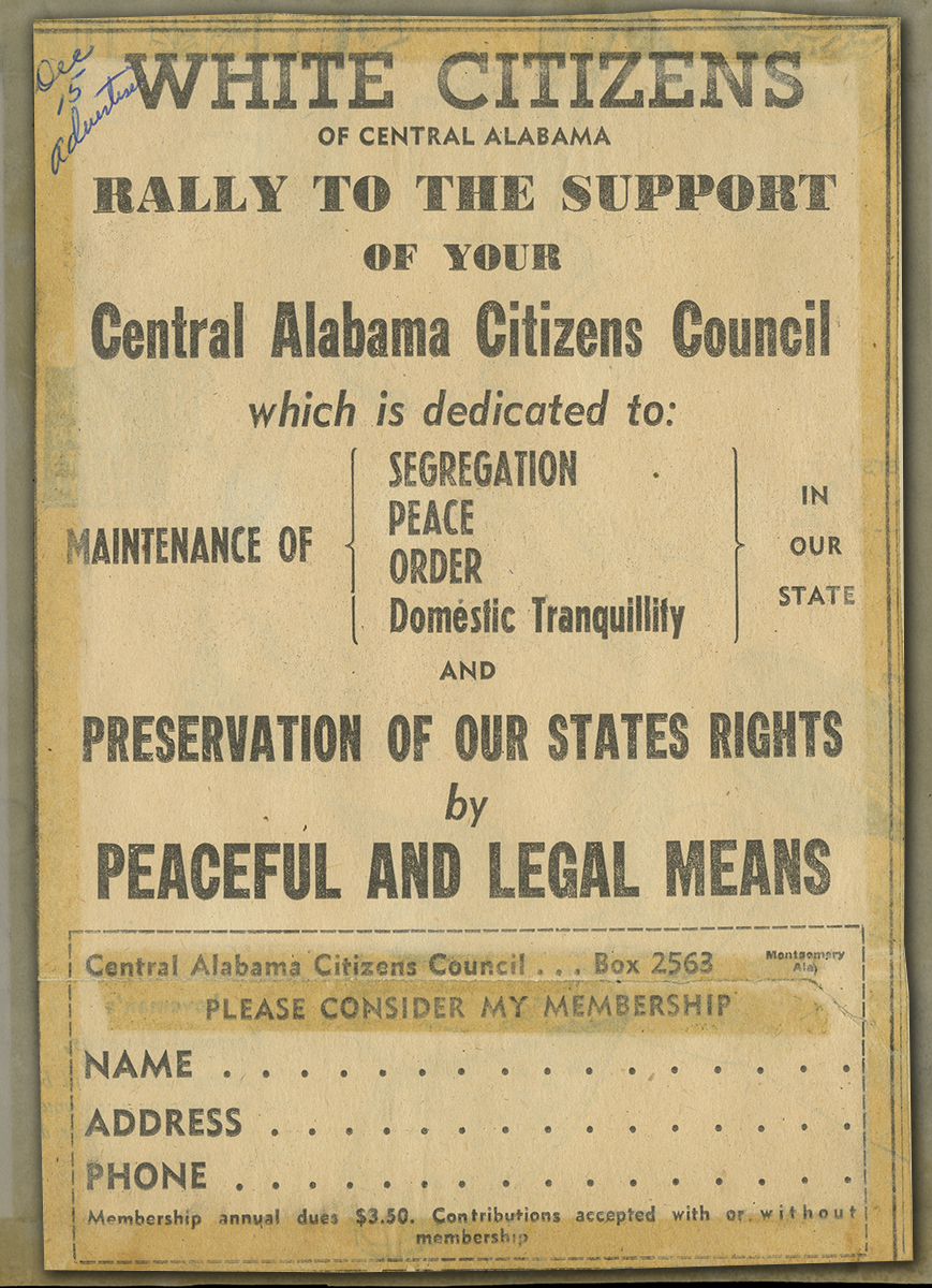 Newspaper headline enlarged over background of yellowed newspaper article text