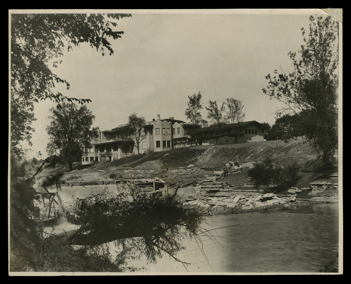 Construction site of large house by a body of water