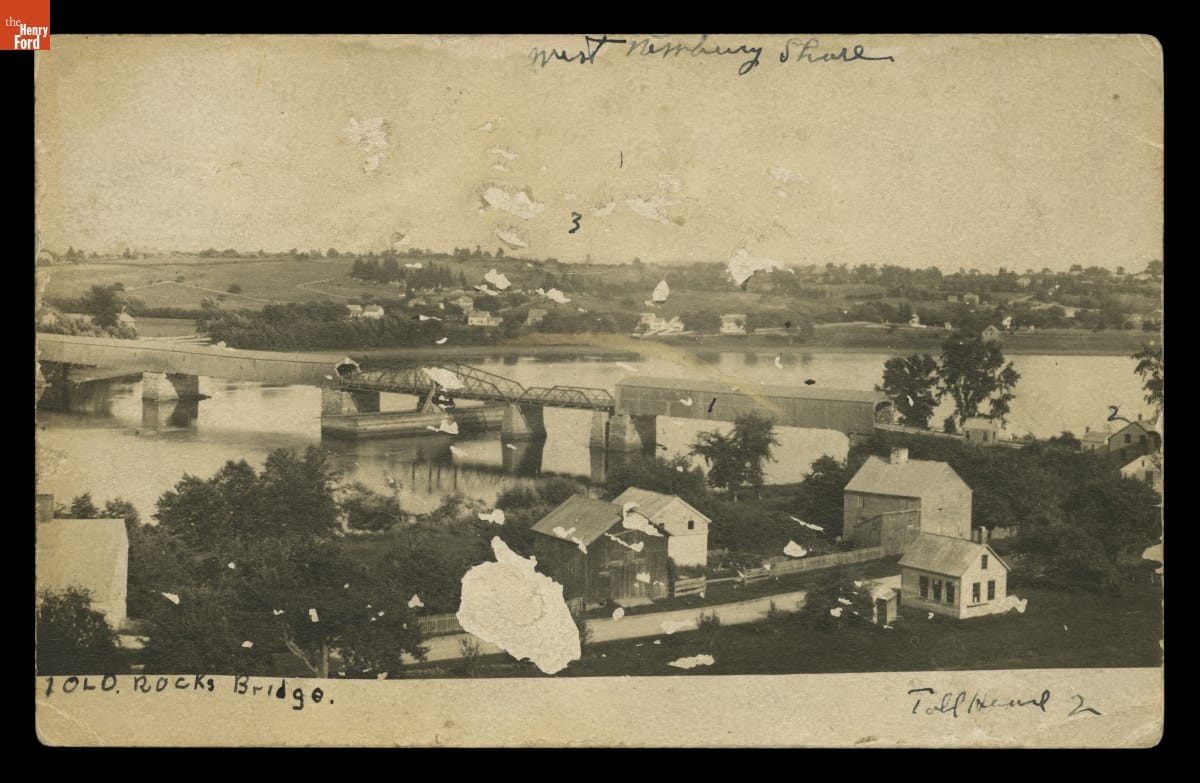 Body of water with buildings on either side and a bridge across