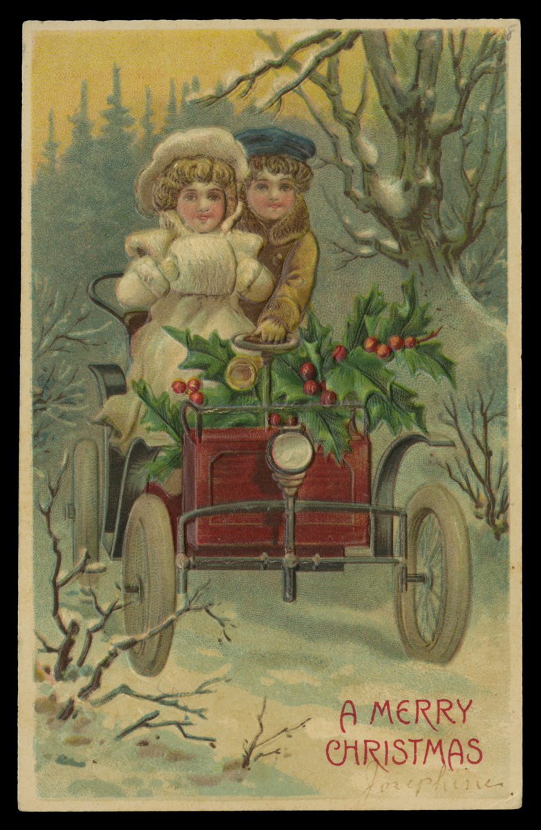 Postcard of two people in an open car decked with holly in a snowy woods
