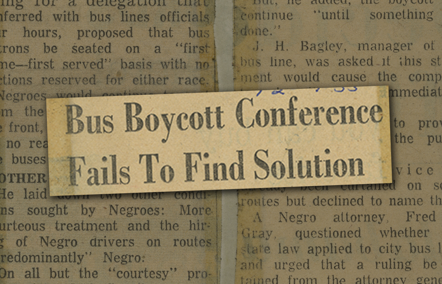 Newspaper headline enlarged over background of yellowed newspaper article text