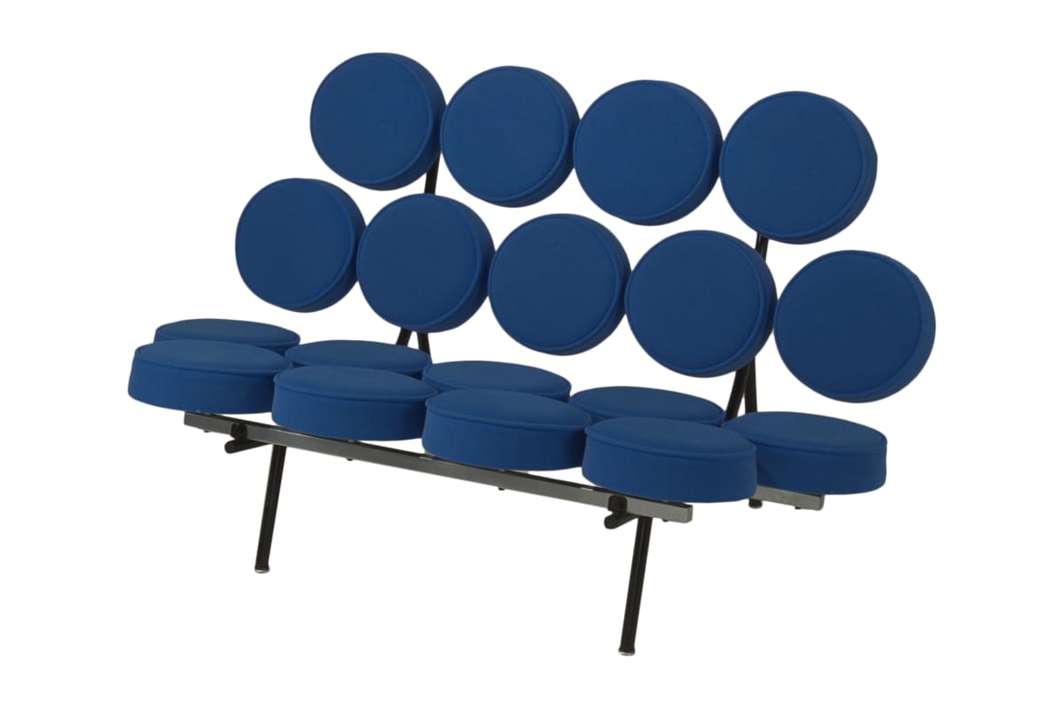 Love seat with minimal metal frame and seat and back each composed of nine blue fabric-covered rounds