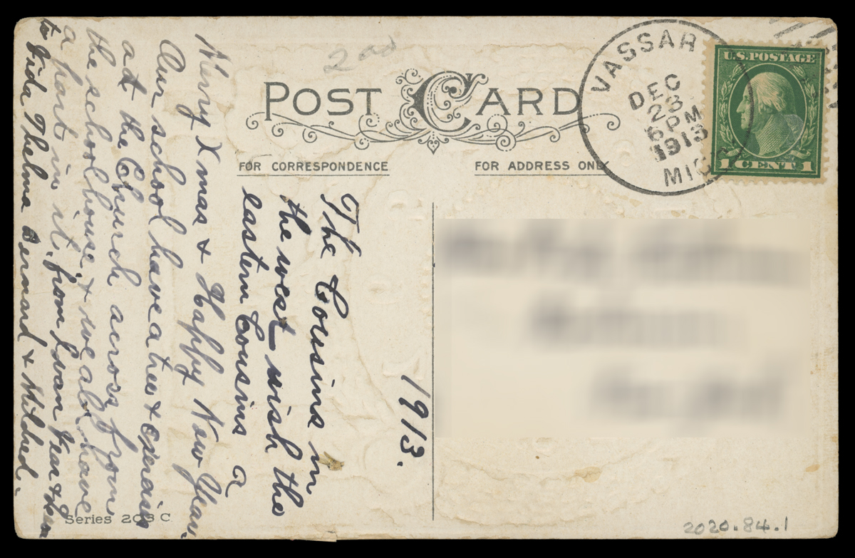 Postcard with handwritten text, blurred address, and one-cent stamp