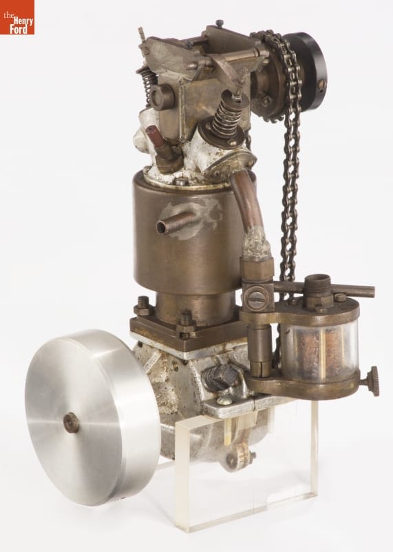 Engine with chain and brass, silver, and gold parts