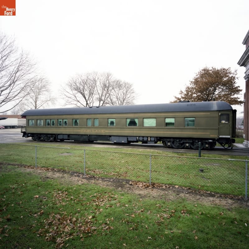 Henry Ford's Private Railroad Car "Fair Lane," 1921 Drab green railcar sitting on railroad tracks