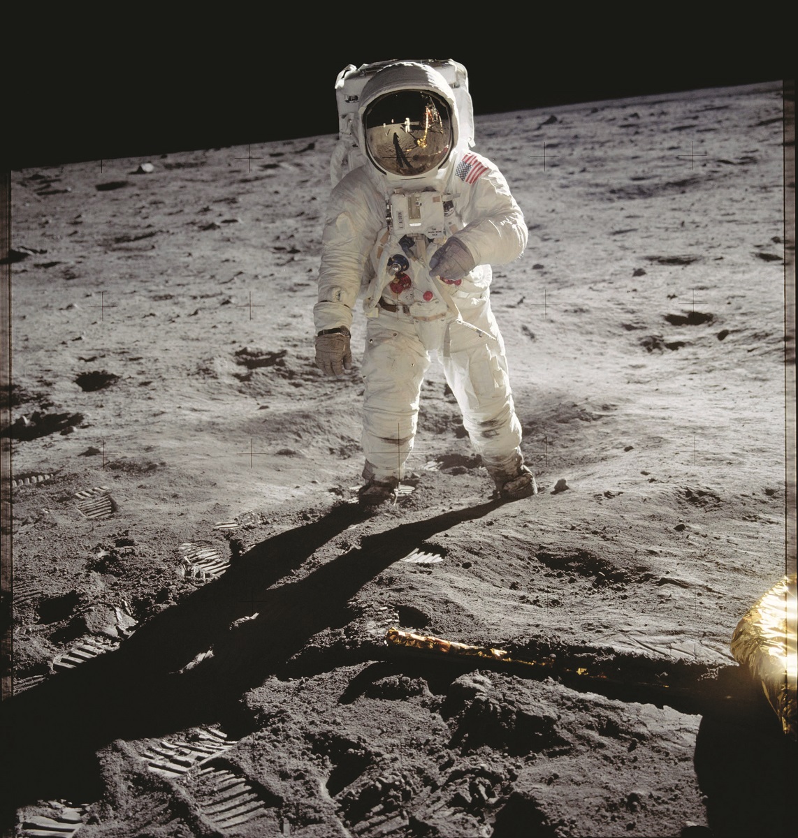 Apollo 11 astronaut Buzz Aldrin on the Moon Person in spacesuit stands on the lunar surface with black space behind them