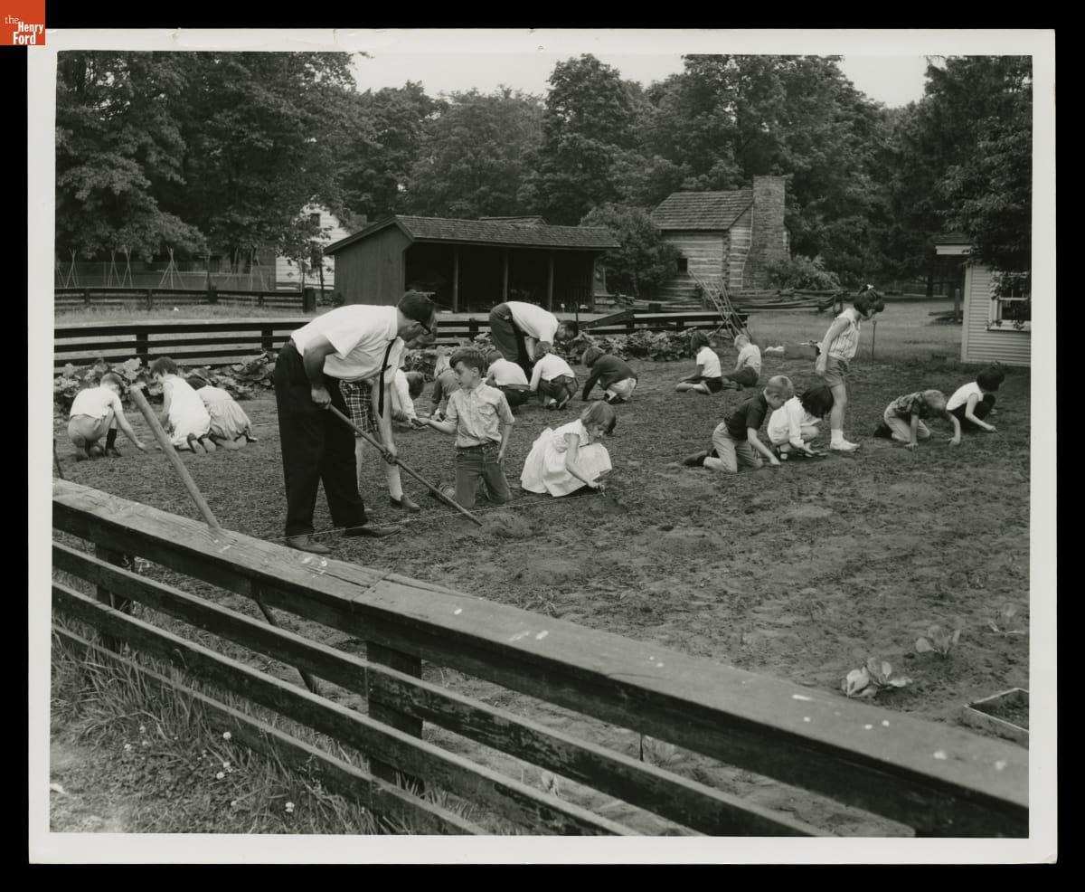 Students planting a garden behind McGuffey School in Greenfield Village, 1967